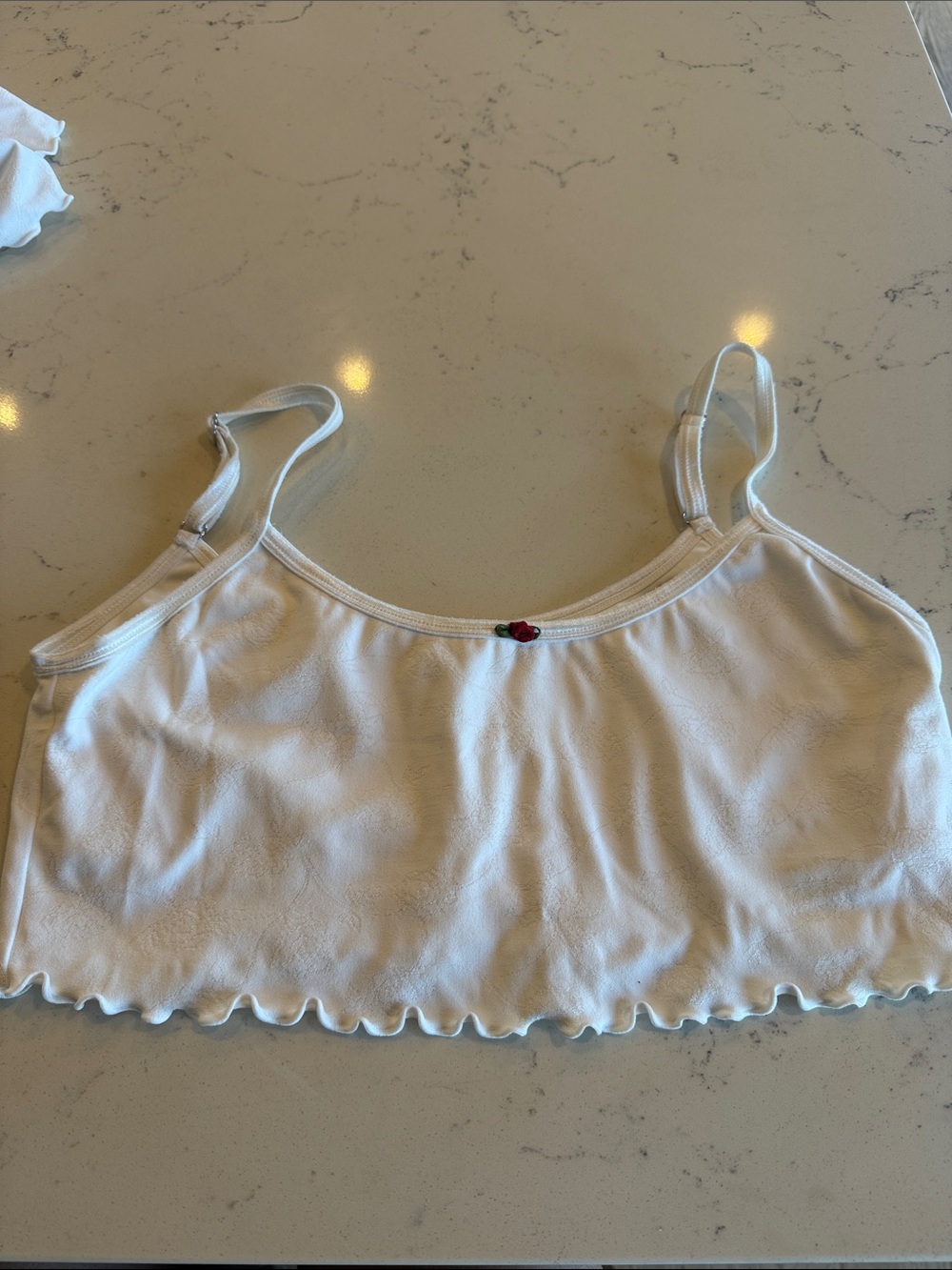 Frankie’s Bikinis crop rosewater active top